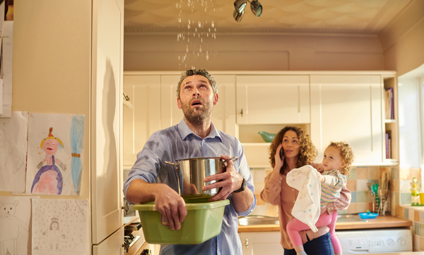 a man and a woman standing in a kitchen